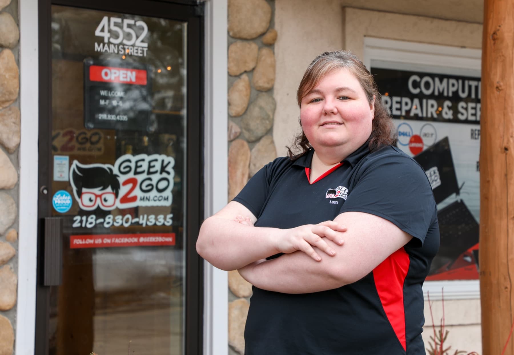 Geek2Go technician standing outside the Pequot Lakes storefront